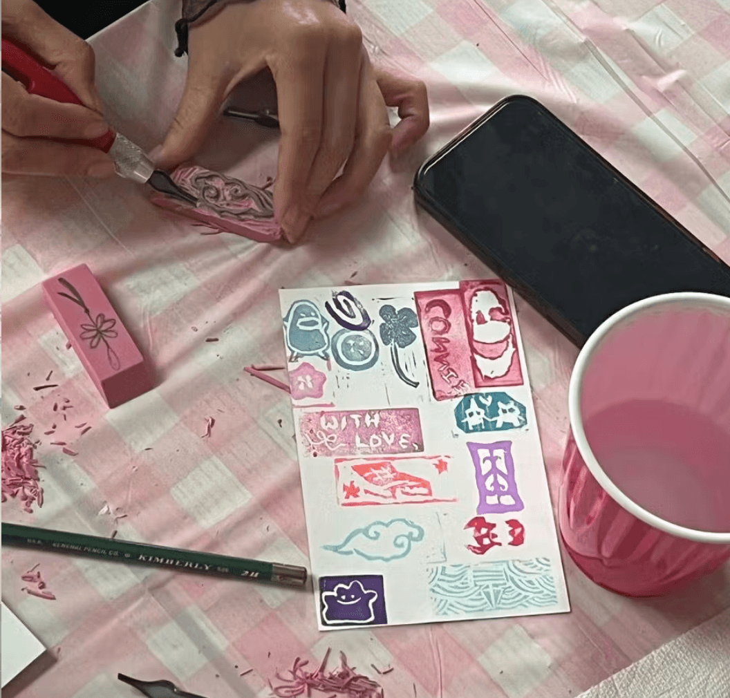 linocut stamps, jasmine's hand cutting the block